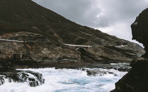 Preview wallpaper coast, rocks, bridge, waves, sea