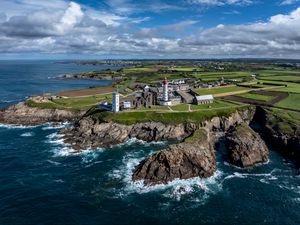 Preview wallpaper coast, rocks, buildings, sea, waves