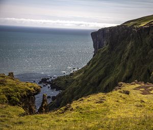 Preview wallpaper coast, rocks, cliff, sea, grass