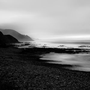 Preview wallpaper coast, rocks, fog, black and white