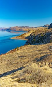 Preview wallpaper coast, rocks, hills, lake, sky