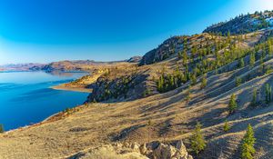 Preview wallpaper coast, rocks, hills, lake, sky