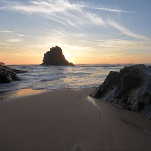 Preview wallpaper coast, rocks, sea, water, sunset