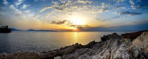 Preview wallpaper coast, rocks, sea, horizon, sun, sunset