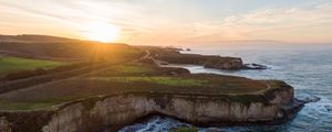 Preview wallpaper coast, rocks, sea, water, sun, landscape, aerial view