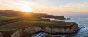 Preview wallpaper coast, rocks, sea, water, sun, landscape, aerial view