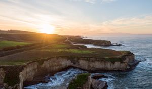 Preview wallpaper coast, rocks, sea, water, sun, landscape, aerial view