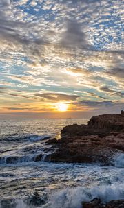 Preview wallpaper coast, rocks, sea, waves, splashes, sunrise