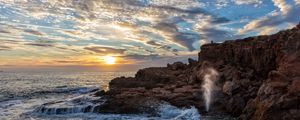 Preview wallpaper coast, rocks, sea, waves, splashes, sunrise