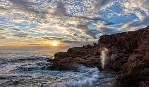 Preview wallpaper coast, rocks, sea, waves, splashes, sunrise