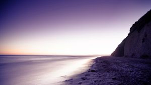 Preview wallpaper coast, sand, beach, rock, lilac