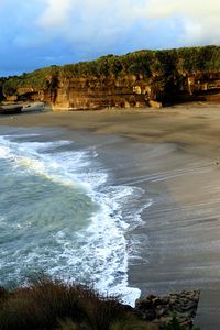 Preview wallpaper coast, sand, sea, waves, foam, rocks