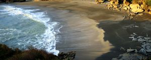 Preview wallpaper coast, sand, sea, waves, foam, rocks