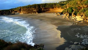 Preview wallpaper coast, sand, sea, waves, foam, rocks