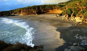 Preview wallpaper coast, sand, sea, waves, foam, rocks