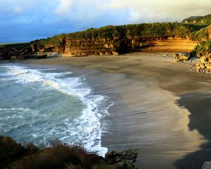 Preview wallpaper coast, sand, sea, waves, foam, rocks