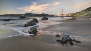 Preview wallpaper coast, sand, stones, sea, bridge