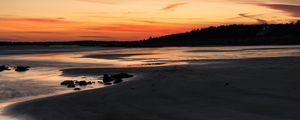 Preview wallpaper coast, sand, stones, sea, trees, sunset