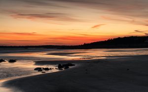 Preview wallpaper coast, sand, stones, sea, trees, sunset