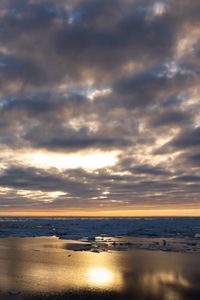 Preview wallpaper coast, sand, water, clouds, sun, twilight, reflection