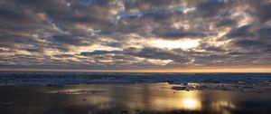 Preview wallpaper coast, sand, water, clouds, sun, twilight, reflection