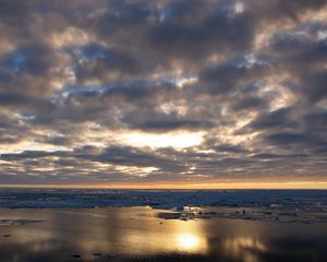Preview wallpaper coast, sand, water, clouds, sun, twilight, reflection