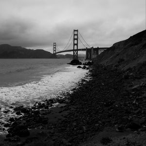 Preview wallpaper coast, sea, bridge, black and white