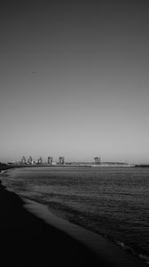 Preview wallpaper coast, sea, bw, beach, buildings