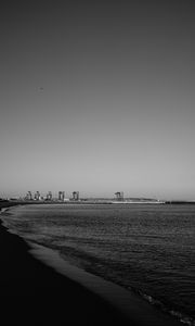 Preview wallpaper coast, sea, bw, beach, buildings