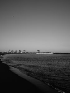 Preview wallpaper coast, sea, bw, beach, buildings