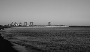 Preview wallpaper coast, sea, bw, beach, buildings