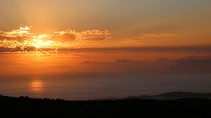 Preview wallpaper coast, sea, clouds, sunset, dark