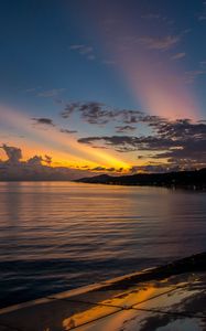 Preview wallpaper coast, sea, clouds, rays, sunset, dark