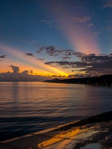 Preview wallpaper coast, sea, clouds, rays, sunset, dark