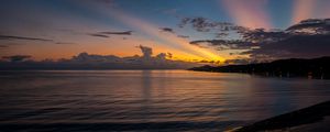 Preview wallpaper coast, sea, clouds, rays, sunset, dark