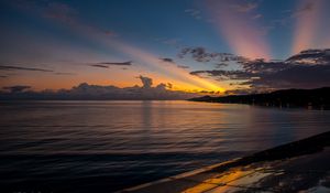 Preview wallpaper coast, sea, clouds, rays, sunset, dark