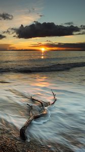 Preview wallpaper coast, sea, clouds, sun, sunset