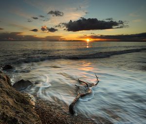 Preview wallpaper coast, sea, clouds, sun, sunset