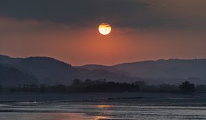 Preview wallpaper coast, sea, hills, sun, sunset