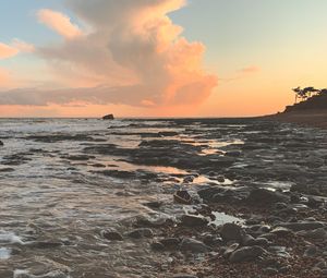 Preview wallpaper coast, sea, pebbles, stones, sunset