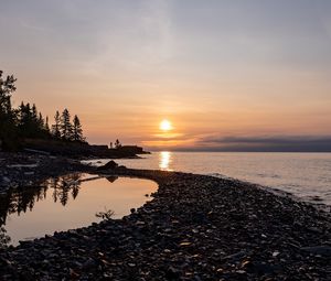 Preview wallpaper coast, sea, pebbles, nature, sunrise