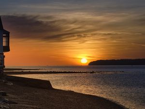 Preview wallpaper coast, sea, pier, sunset, hills