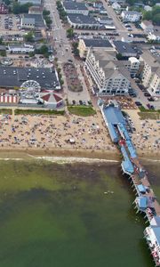 Preview wallpaper coast, sea, pier, buildings, beach