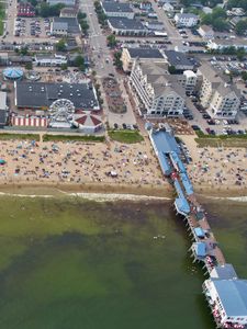 Preview wallpaper coast, sea, pier, buildings, beach