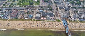 Preview wallpaper coast, sea, pier, buildings, beach