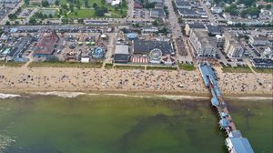 Preview wallpaper coast, sea, pier, buildings, beach