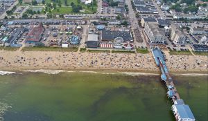 Preview wallpaper coast, sea, pier, buildings, beach