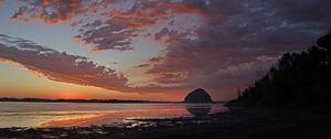 Preview wallpaper coast, sea, rock, hill, evening