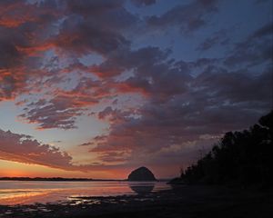Preview wallpaper coast, sea, rock, hill, evening