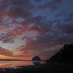 Preview wallpaper coast, sea, rock, hill, evening